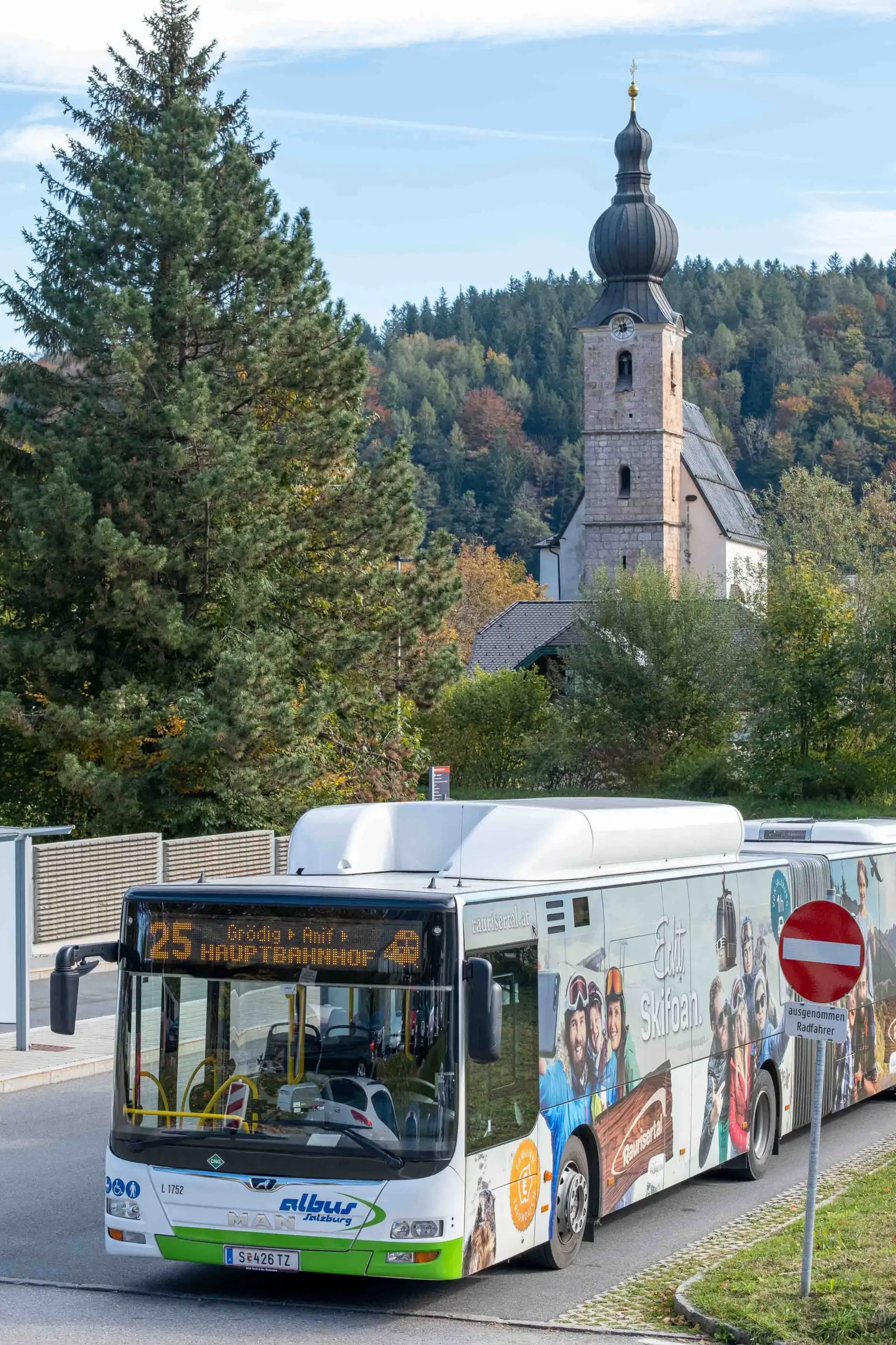 A city bus stopped beside the parish church in Grodig near Salzburg
