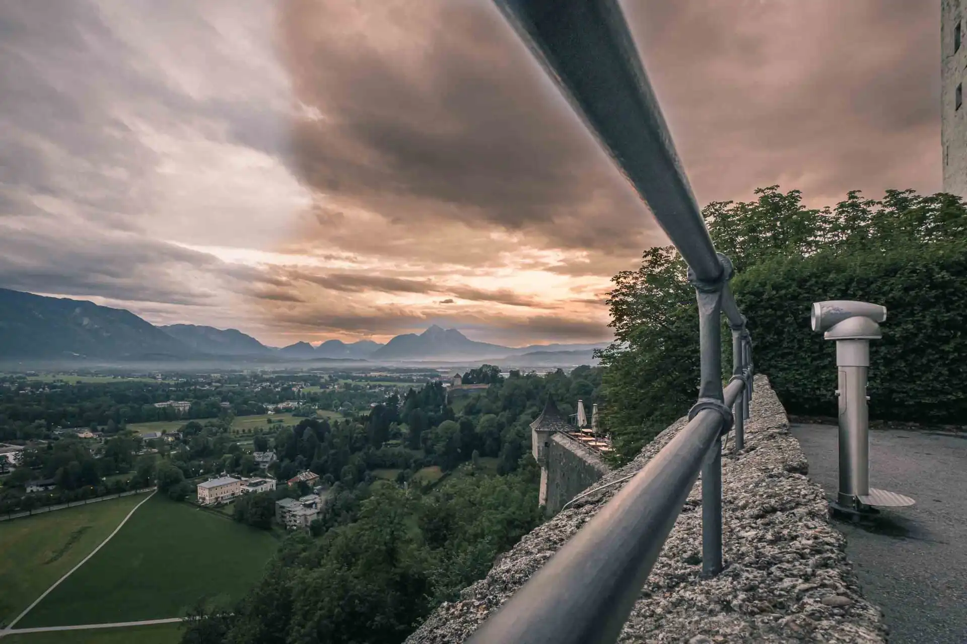 Hohensalzburg fortress glowing at sunset above Salzburg