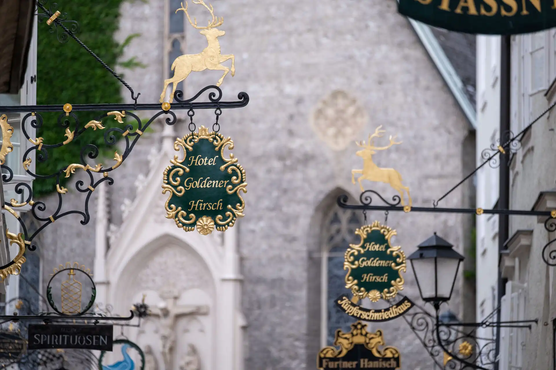hotel goldener hirsch wrought iron signs 01