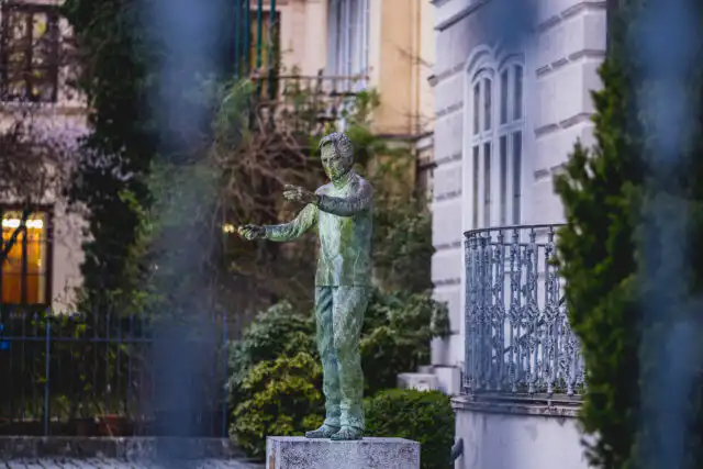 bronze statue of herbert von karajan conducting on makartplatz in salzburg