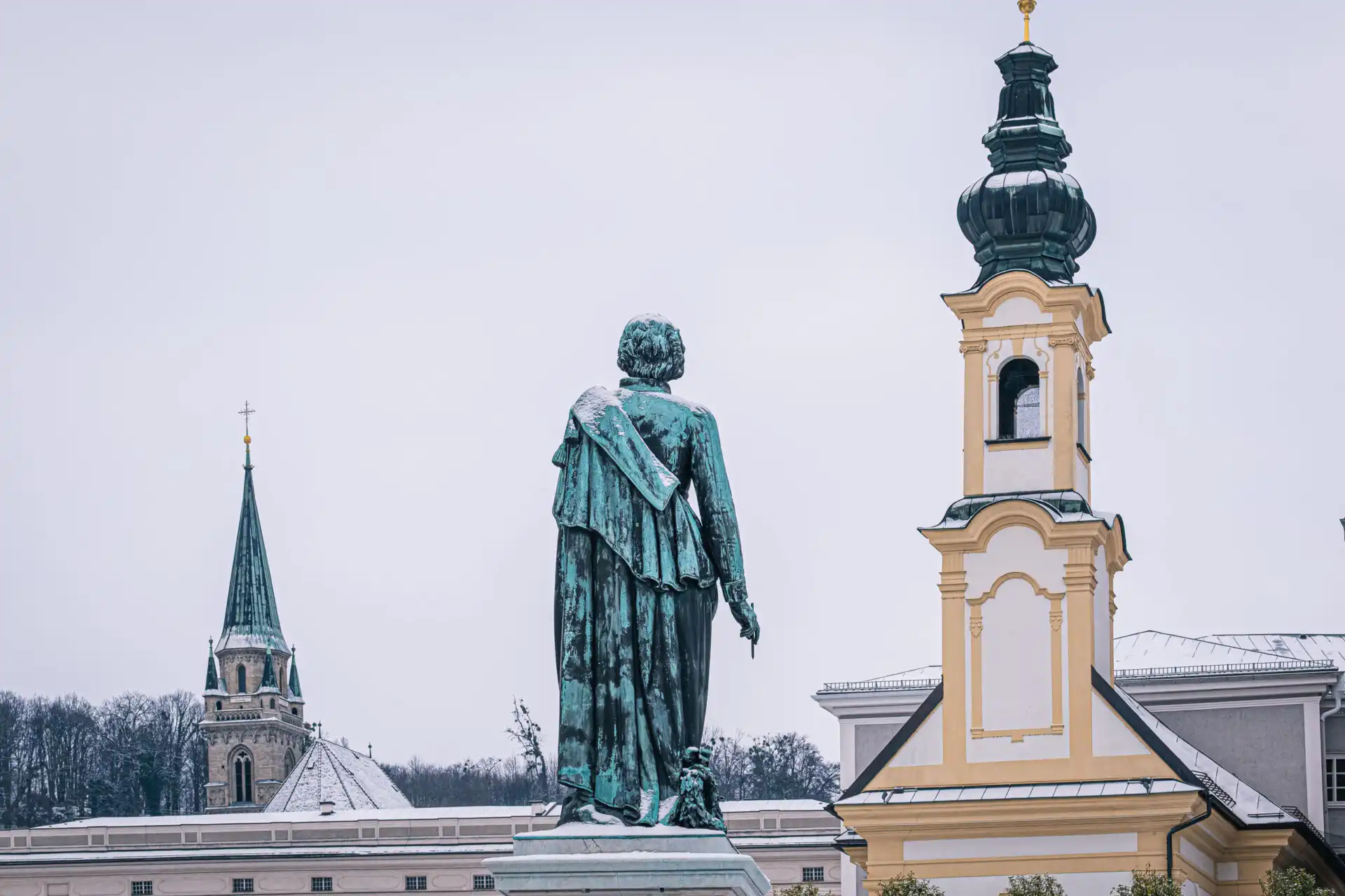 mozartplatz archbishop statue church winter 01