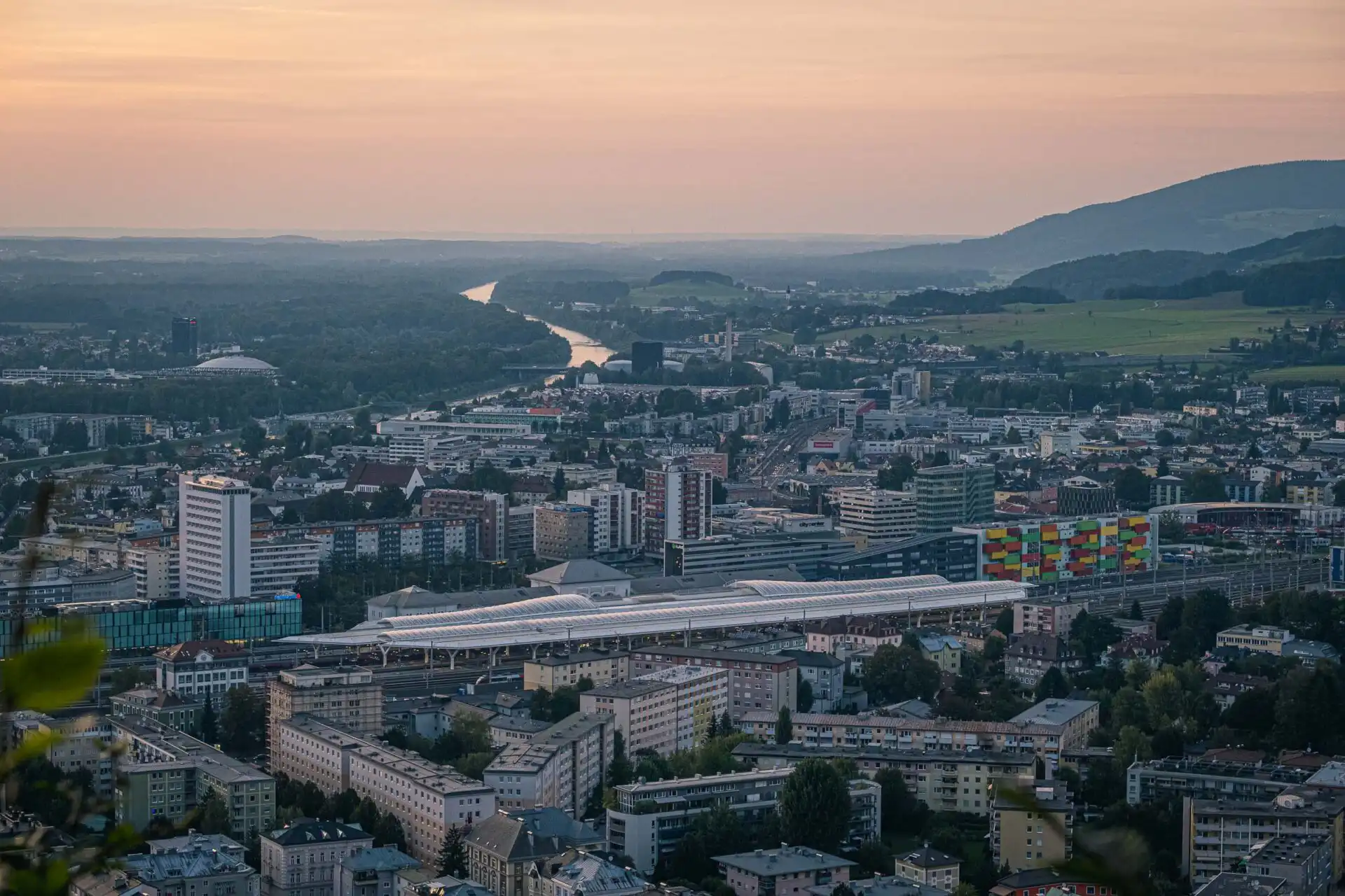 salzburg hauptbahnhof from kapuzinerberg dusk 01