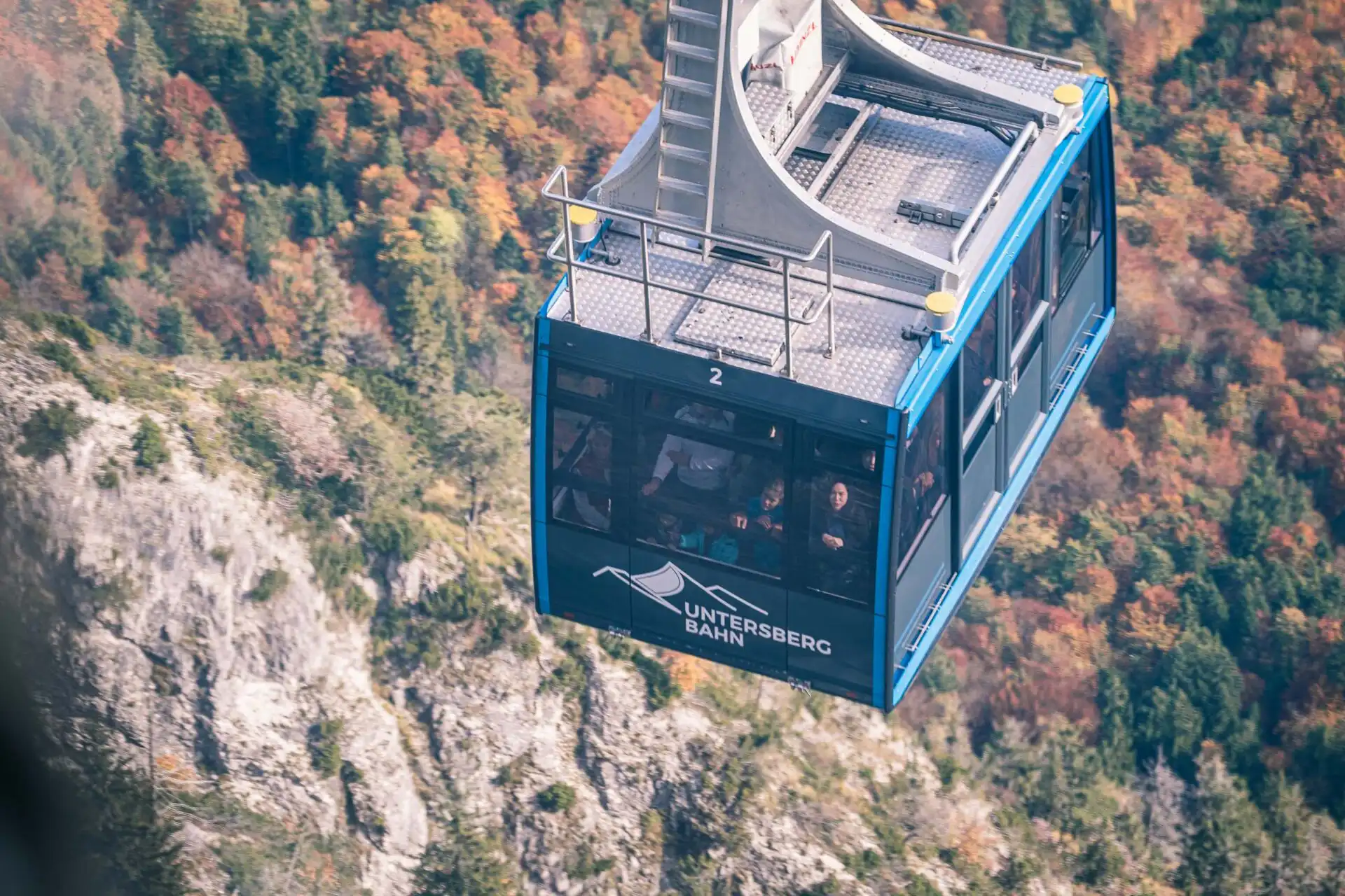 Untersbergbahn cable car cabin climbing above autumn slopes near Salzburg